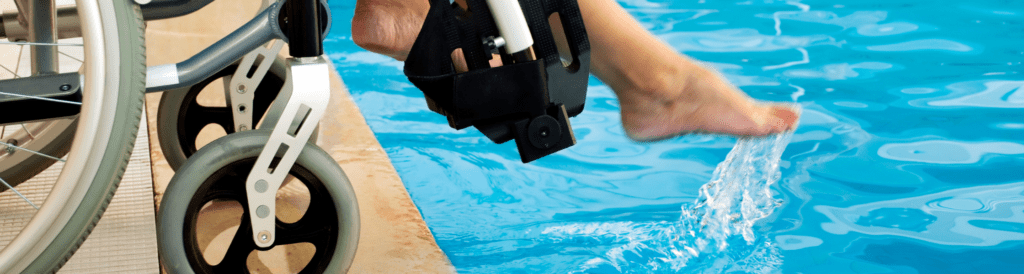 Wheelchair next to pool with swimmer, disability organizations #GivingTuesday